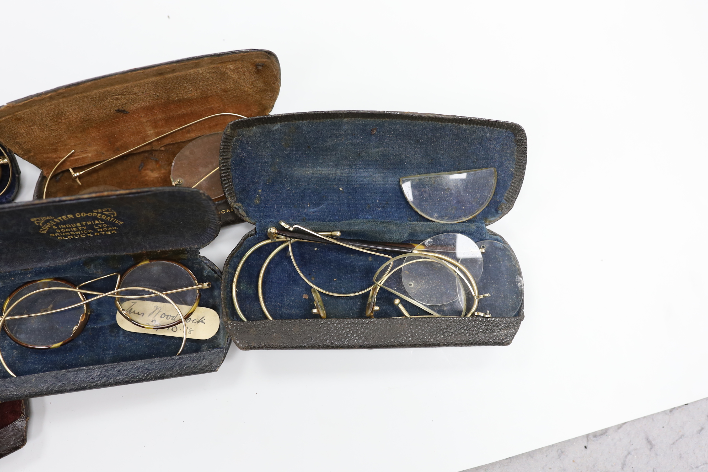 A quantity of spectacles and cases